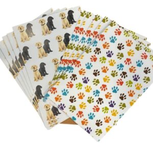 Gift wrap featuring paw prints and two labradors – one yellow and one black